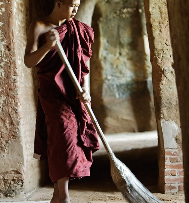 Buddhist Monk sweeping
