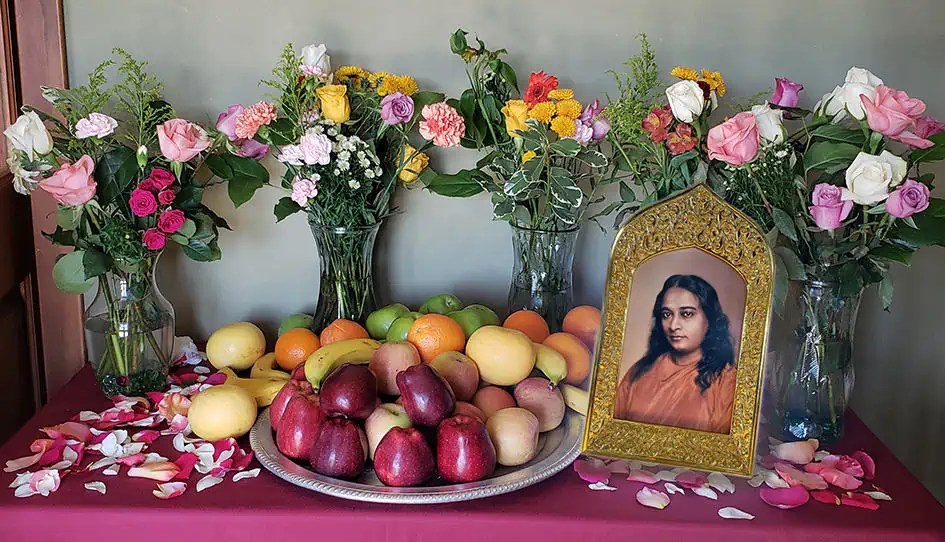 Yogananda Photo on table of fruit & flowers