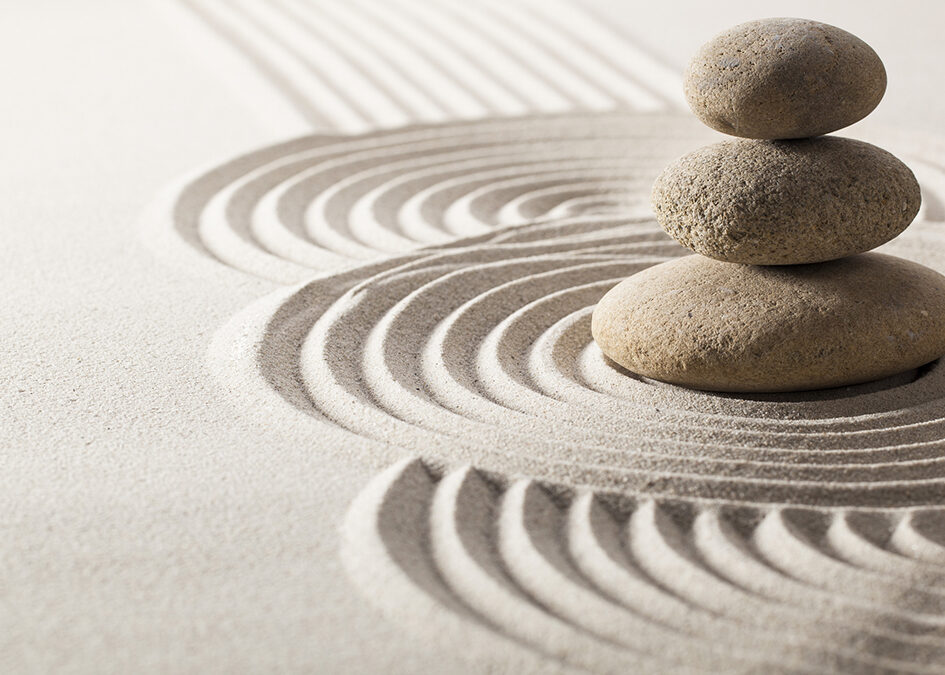 Zen garden: raked sand and stacked rocks